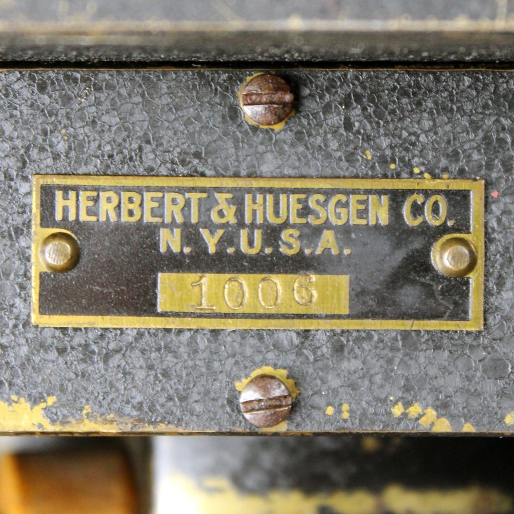 Badge from Herbet & Huesgen Co. tripod