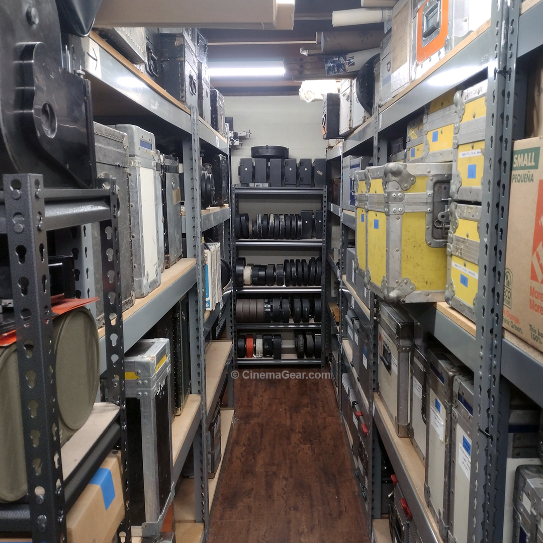 A view down the center aisle of our warehouse space, showing where we moved a shelving unit of motion picture camera magazines