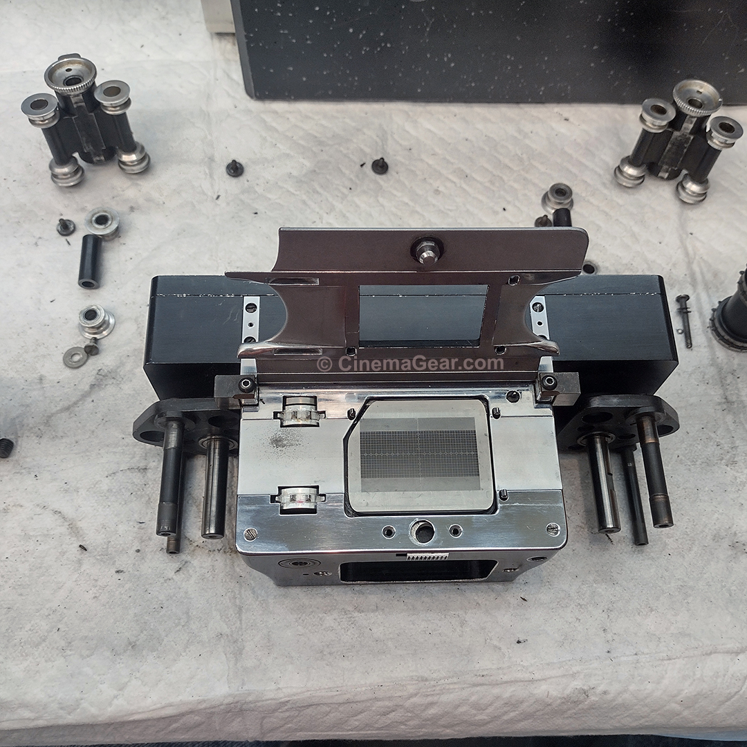 The movement from the Dykstraflex camera being serviced. Note the ground glass in built-in to the movement’s pressure plate, and the 3 registration pins