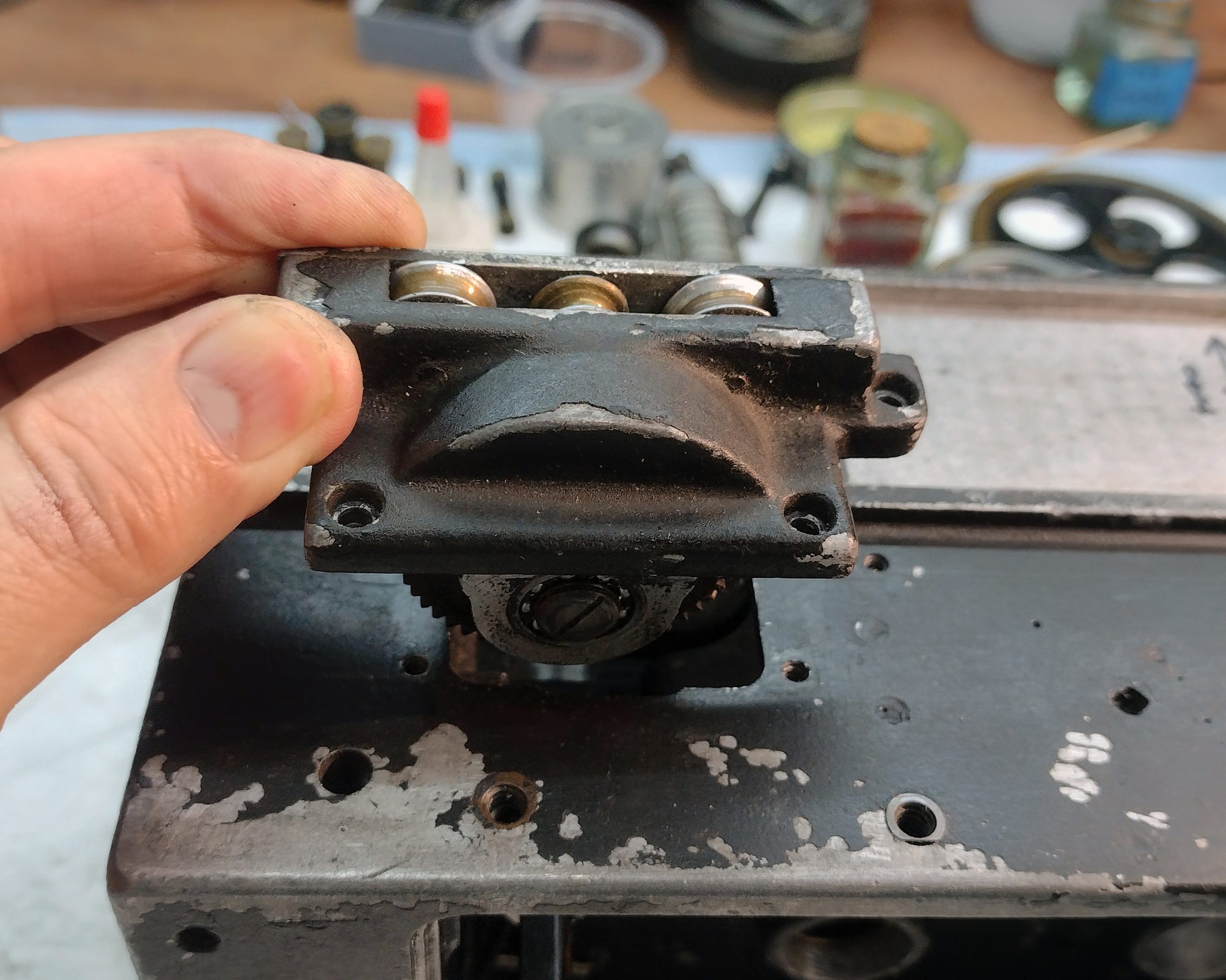 Mitchell Standard 46 magazine drive belt clutch assembly being reinstalled.