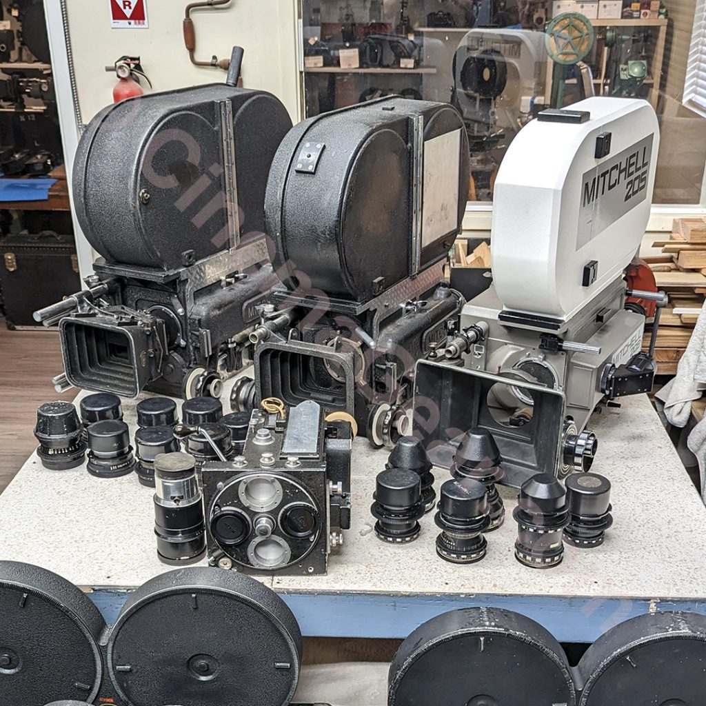 A close-up view of the 4 Mitchell Cameras, (rackover Mitchell BNC, Mitchell BNCR, Mitchell 205, and Mitchell Standard), plus the sets of Baltar and Super Baltar lenses.