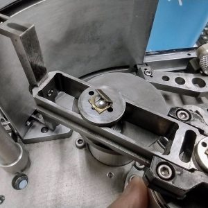 Repairing the locking tab that keeping the pull-down claw thrust washer in place on the Fries Ultra 70 3x65 IMAX-format camera