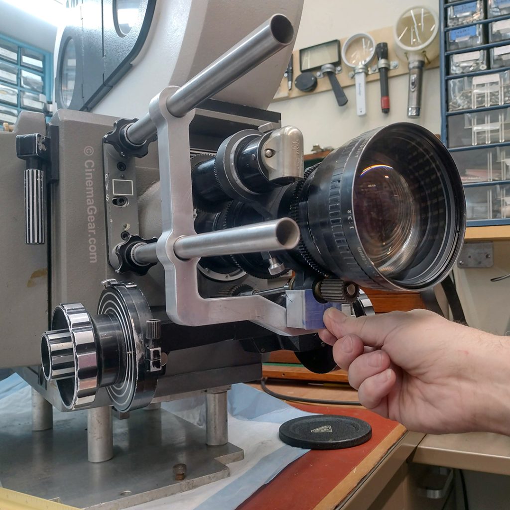 fitting the jackscrew to the bottom of the lens support bracket for the Mitchell 205