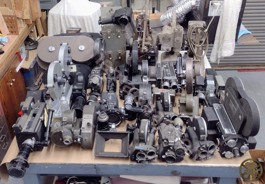 A group of 16mm cameras sitting on top of a workbench. Included in the group of cameras are a Kodak Reflex Special that I had never seen before, along with an ARRI SR1, several ARRI Ss, an ARRI 16 BL, and an ARRI M.